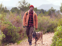 Man hiking with his dog