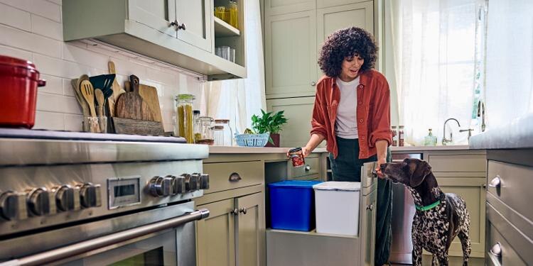 woman with her dog in the kitchen